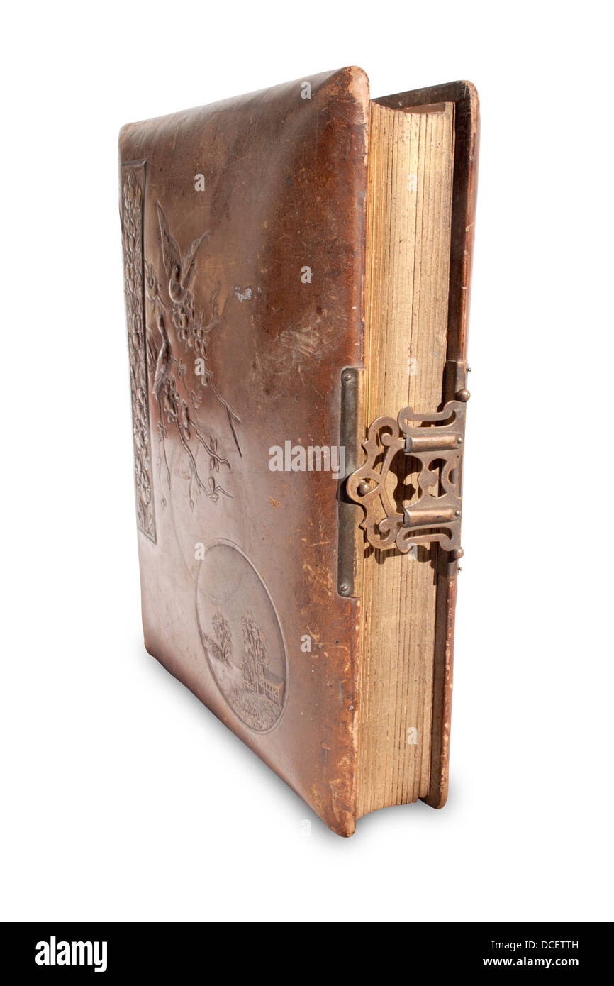 An closed old leather bound antique book with a brass lock and hasp on