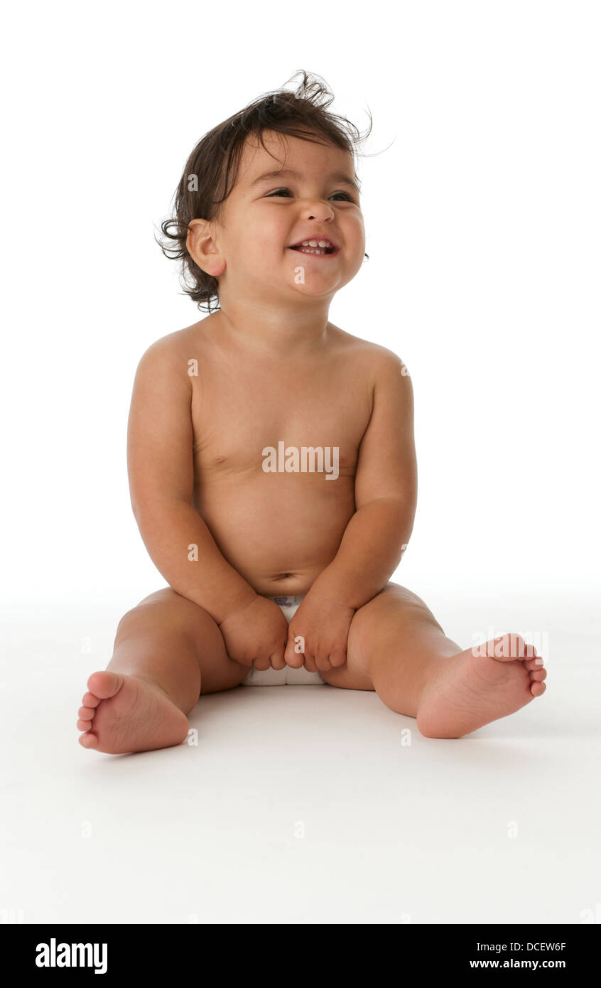 Little girl sitting on the floor in the studio Stock Photo - Alamy