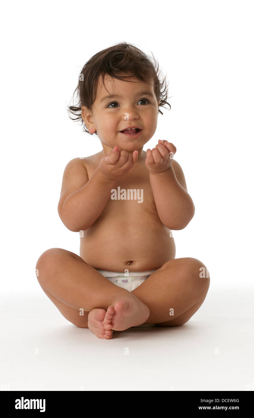 Little girl sitting on the floor in the studio Stock Photo - Alamy