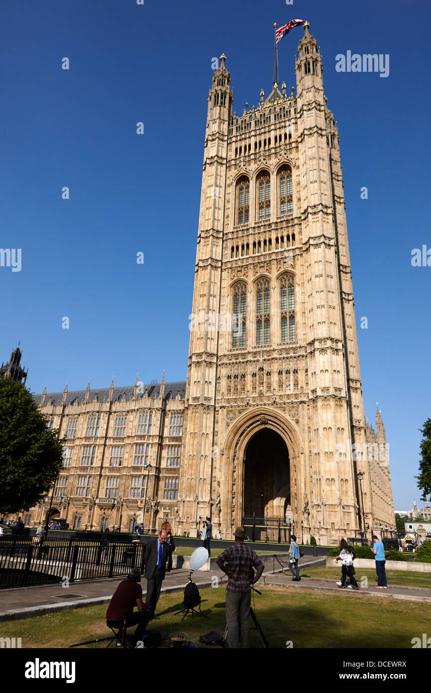 tv media crew on college green in front of victoria tower of the palace of westminster London England UK Stock Photo