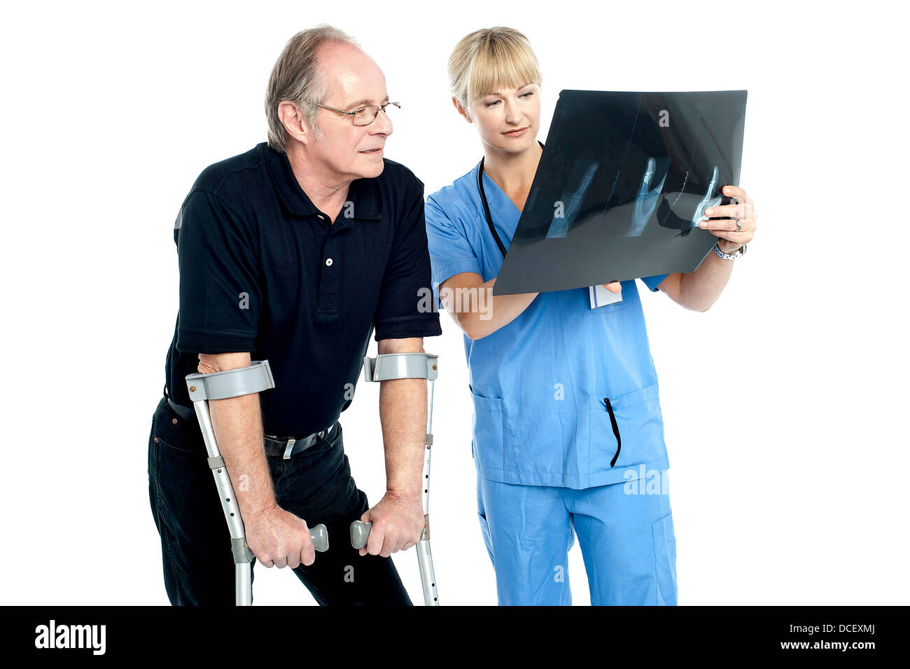 Doctor patient looking x ray Cut Out Stock Images & Pictures - Alamy
