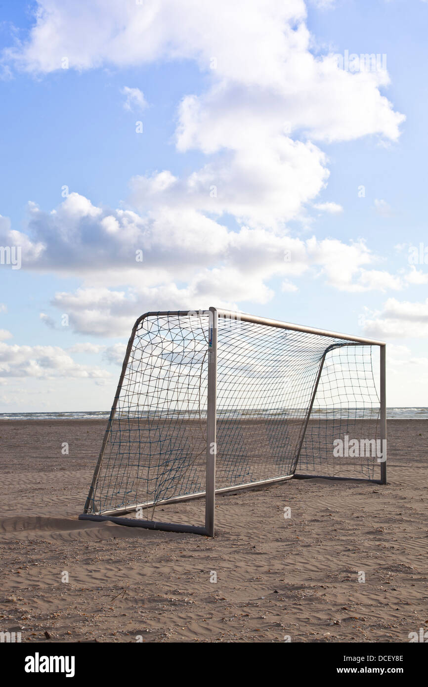 Soccer goal on beach with blue sky Stock Photo