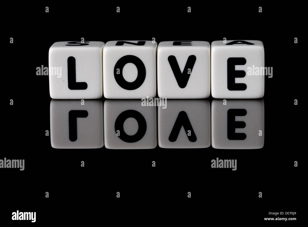 Love Spelled In Dice With The Word Reflected On White Isolated Background Love Spelled In Dice With The Word Reflected On White Isolated Background