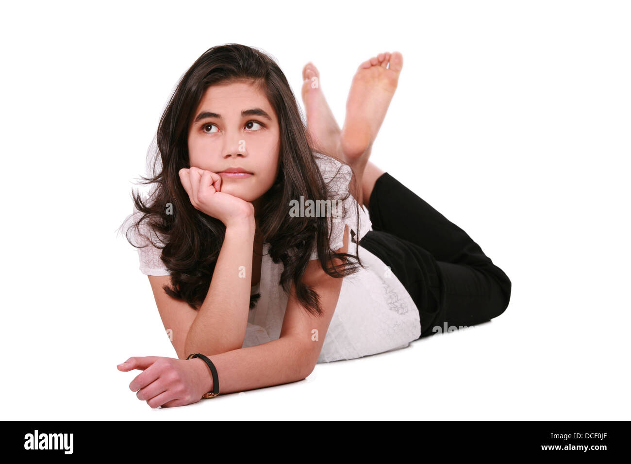 Beautiful teen girl lying on floor relaxing Stock Photo Alamy