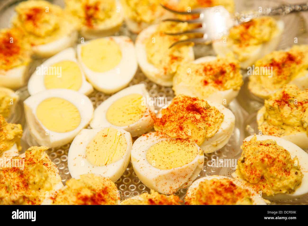 Traditional deviled eggs garnished with paprika on a glass serving dish Stock Photo Alamy