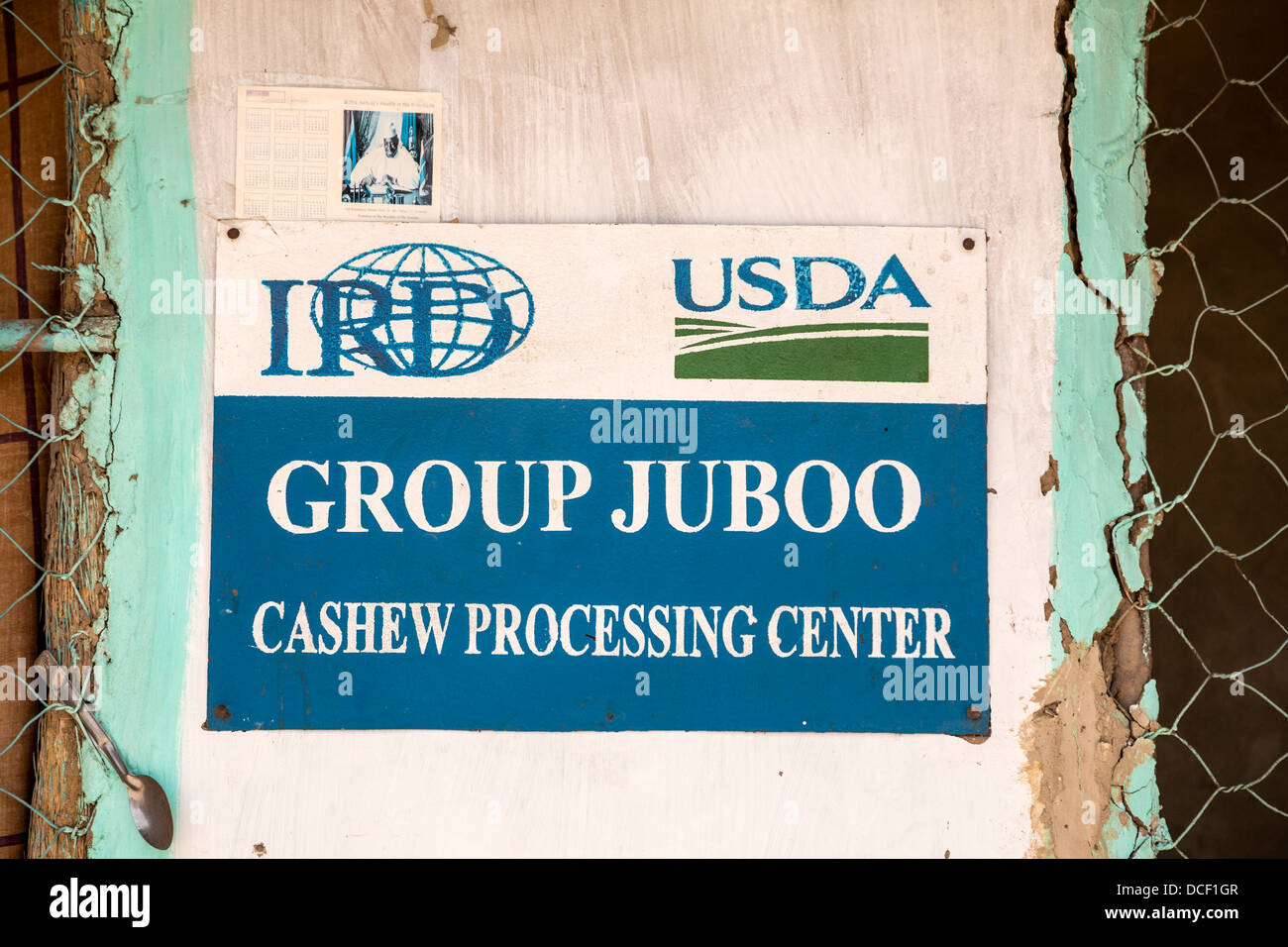 Cashew Nuts. Sign on Wall Identifying Group Juboo Cashew Processing Center, Fass Njaga Choi, North Bank Region, The Gambia Stock Photo