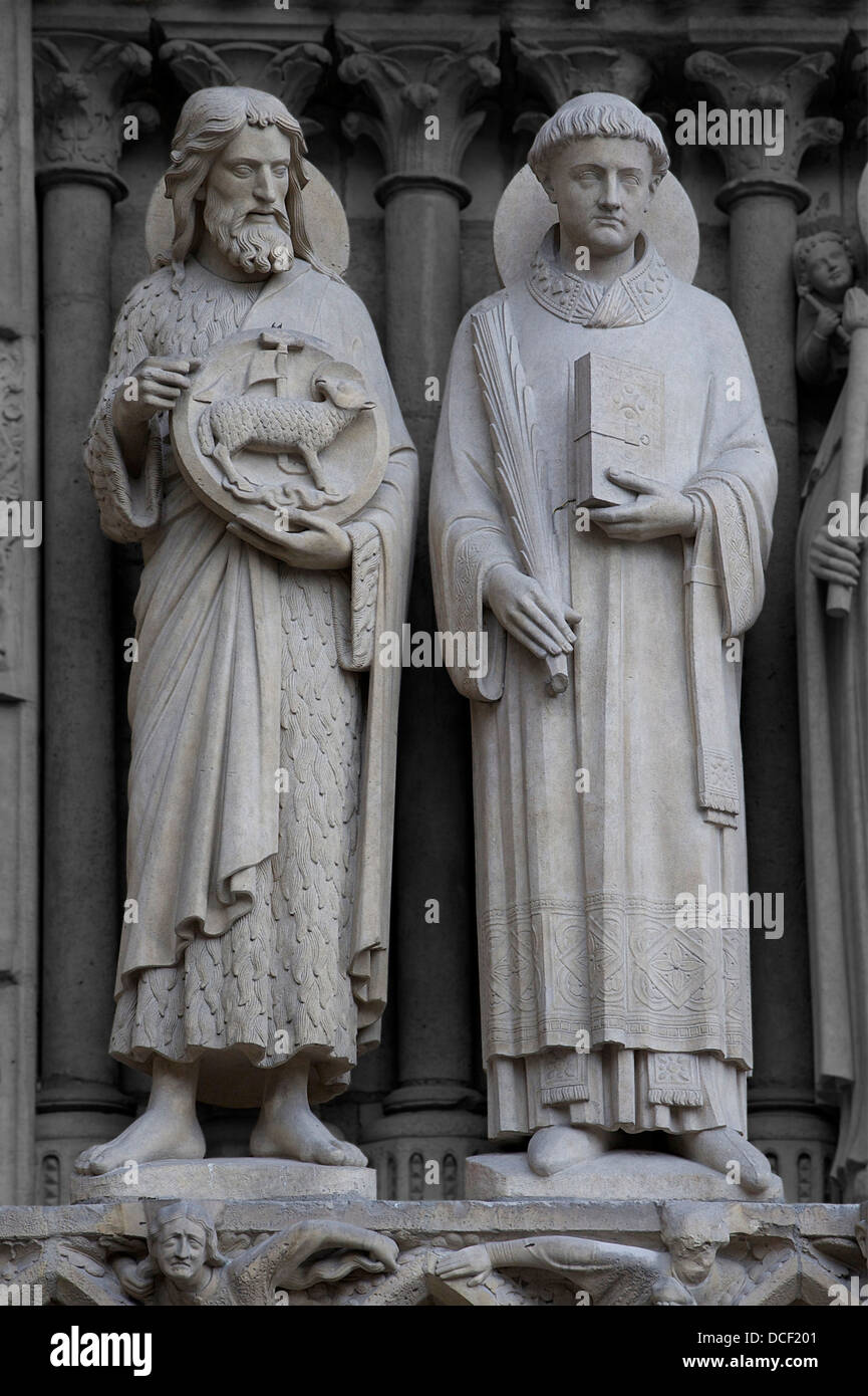 Saint John the Baptist and Saint Stephen, Western façade left Portal (the Virgin portal) of Notre-Dame de Paris, France. Theses Stock Photo