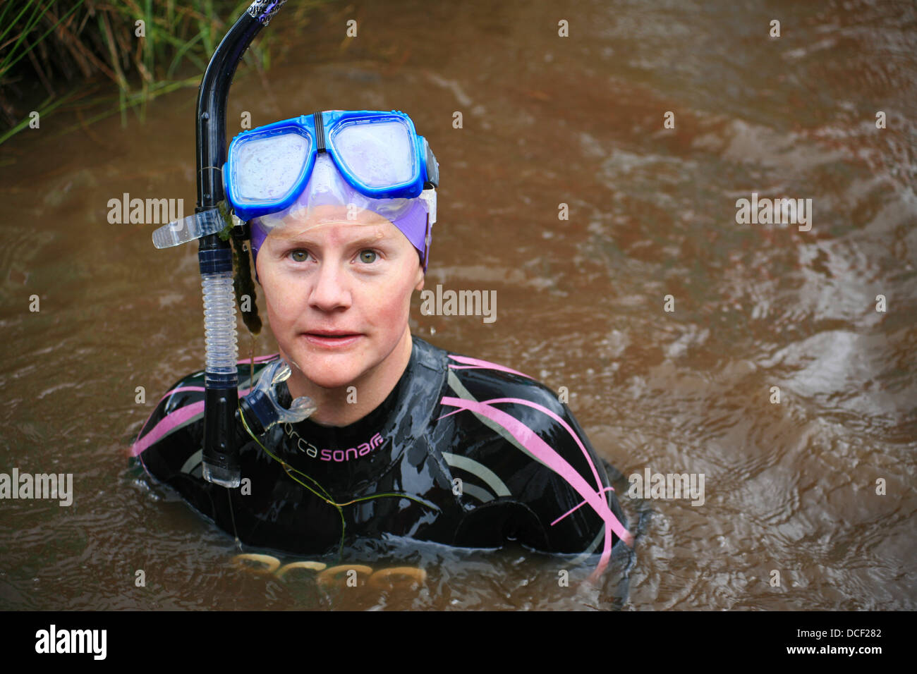 Previous champion just swum in the bog-snorkelling championship in Waen Rhydd peat bog, Llanwrtyd Wells, Wales. Stock Photo