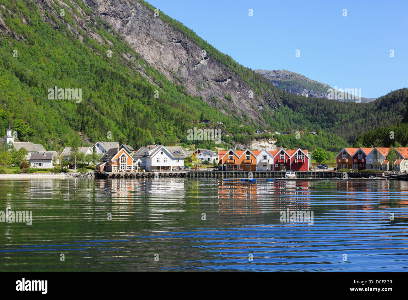 View at end of Mofjorden fjord to pretty village of Mo kommune in summer in picturesque Modalen, Hordaland, Norway, Scandinavia Stock Photo