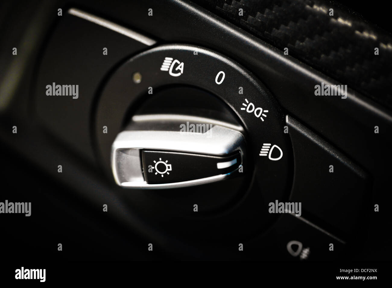 Detail of the headlight button in a car Stock Photo - Alamy
