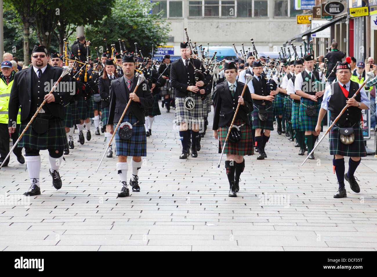 Saint Enoch Square, Glasgow, Scotland, UK, Friday, 16th August, 2013. Four Pipe Bands taking part in the traditional Beat The Retreat during the Piping Live! Festival Stock Photo