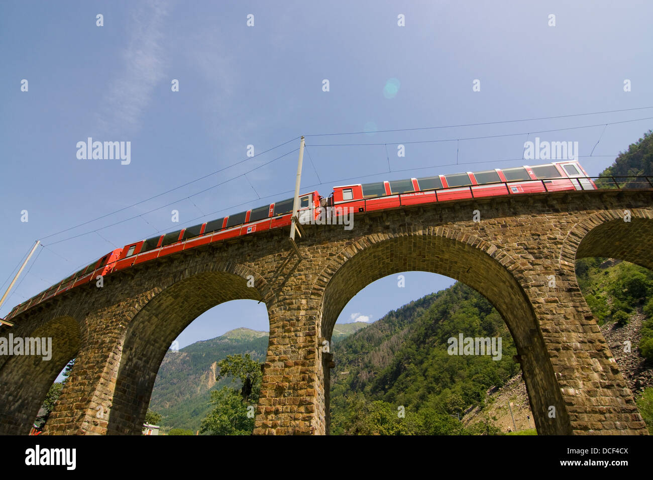 roter Zug der Bernina-Bahn auf dem Viadukt von Brusio; red train of the Berninabahn on the Brusio viaduct Stock Photo