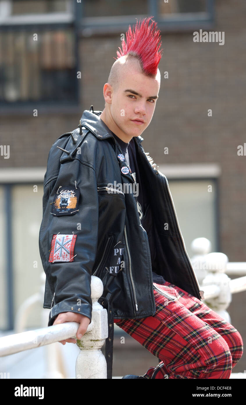 Punk boy with a red mohawk hairstyle Stock Photo