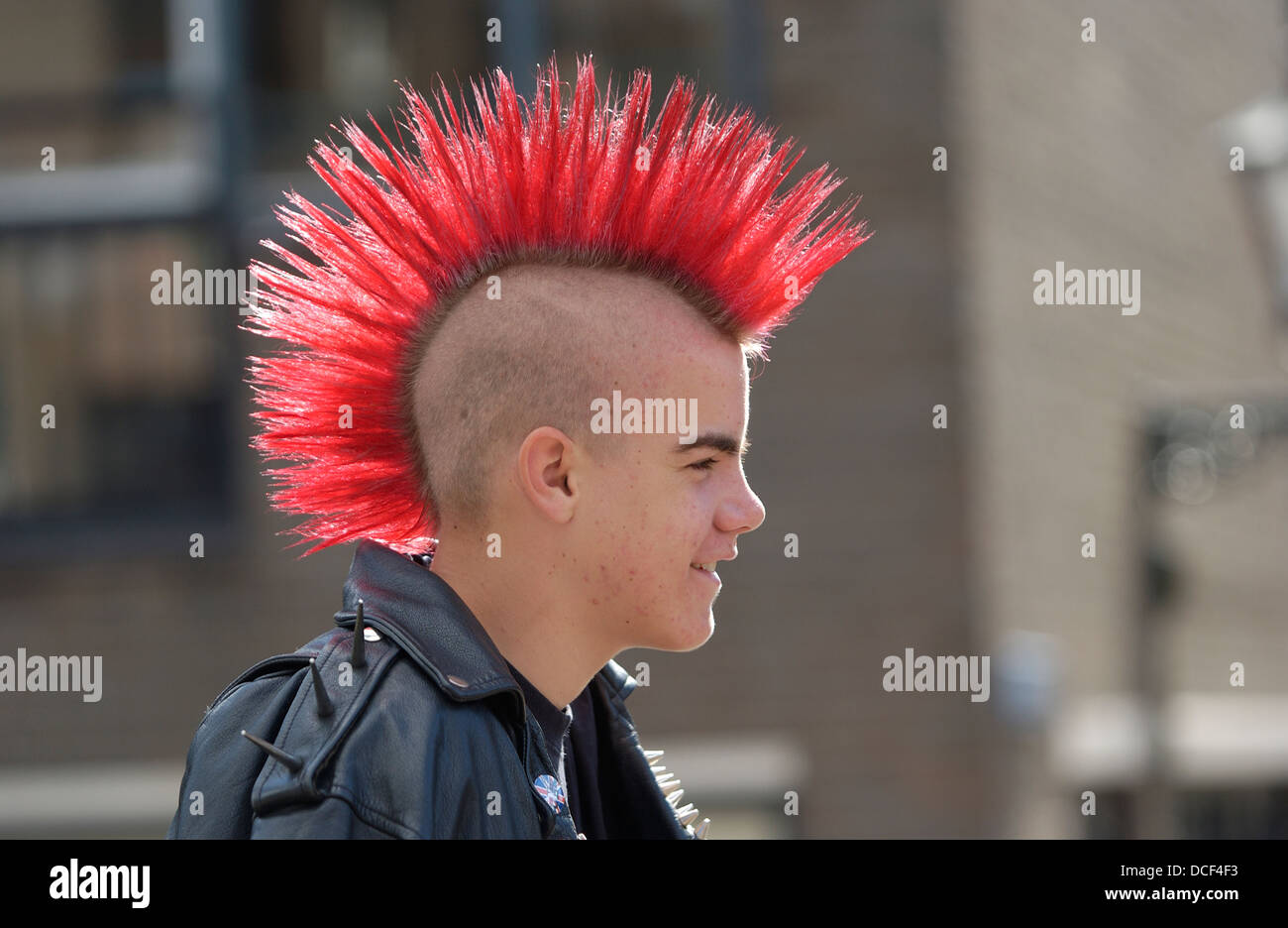 Punk boy with a red mohawk hairstyle Stock Photo - Alamy