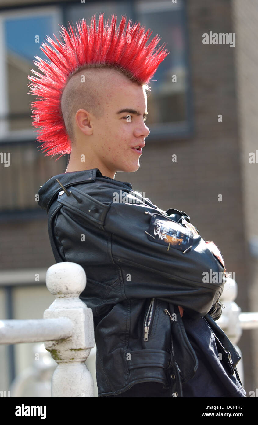 Punk boy with a red mohawk hairstyle Stock Photo