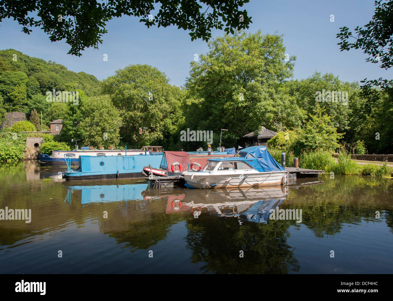 various types of boat at their moorings on the calder and hebble canal