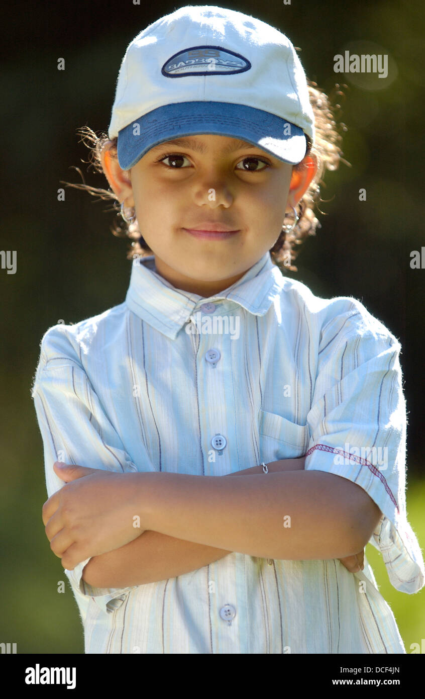 Firm little girl with a cap Stock Photo
