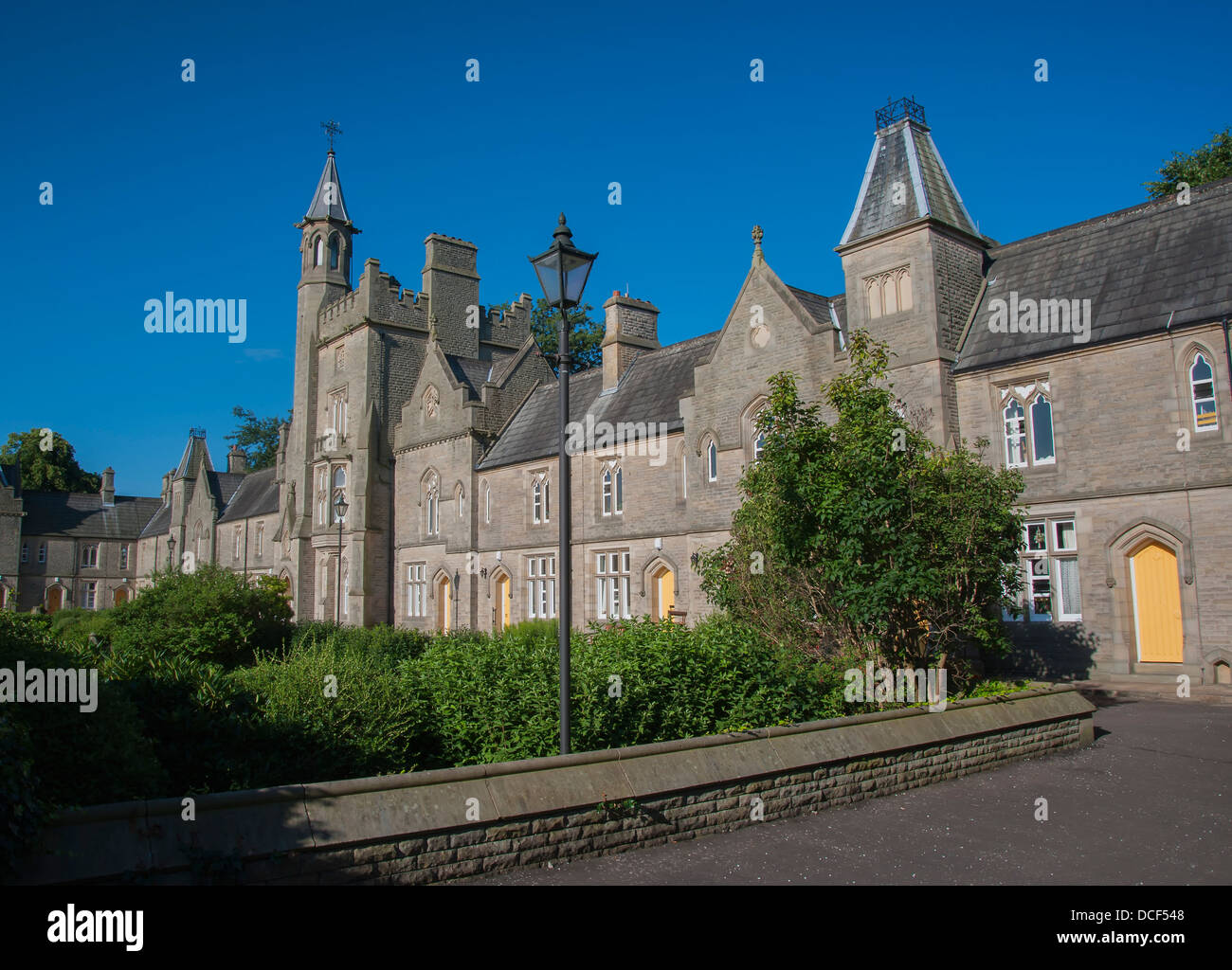 Neo gothic styled victorian almshouses in Halifax, West Yorkshire manufactured from local sandstone Stock Photo