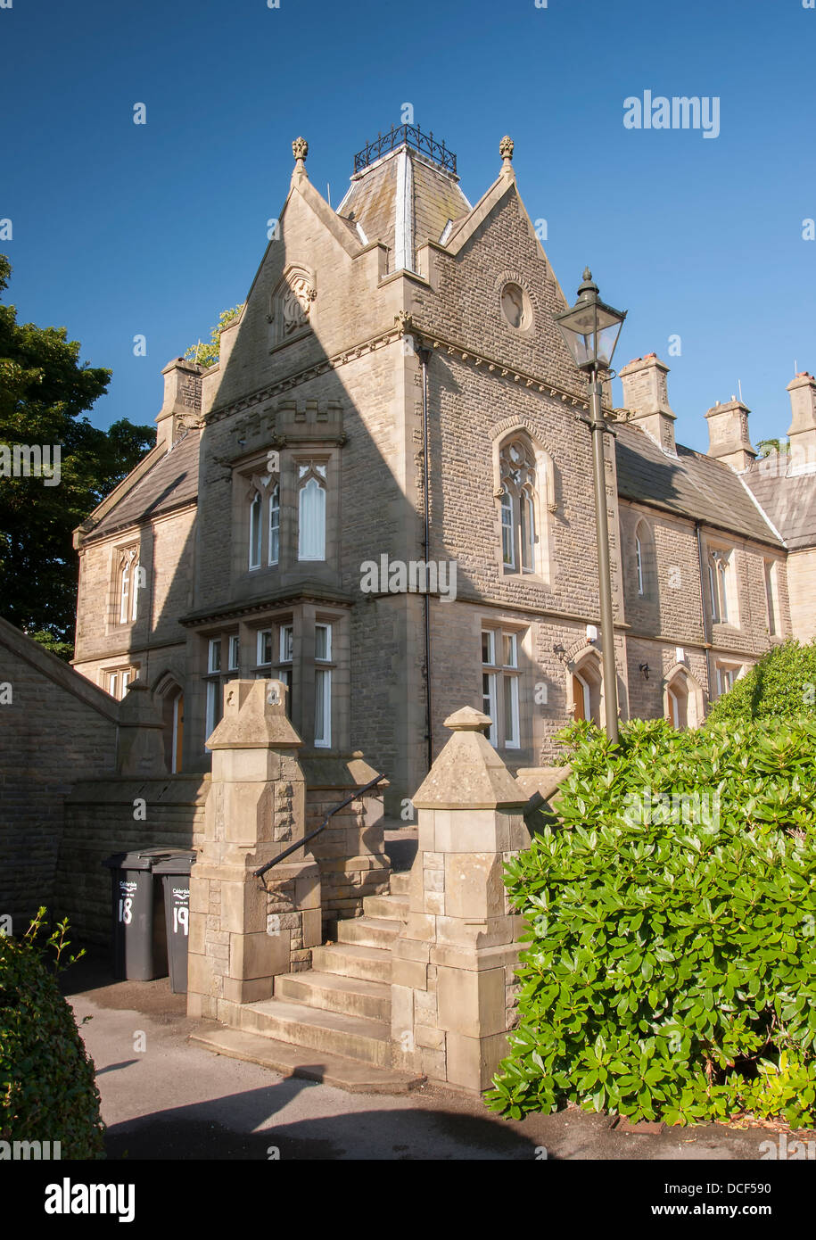 Neo gothic styled victorian almshouses in Halifax, West Yorkshire manufactured from local sandstone Stock Photo
