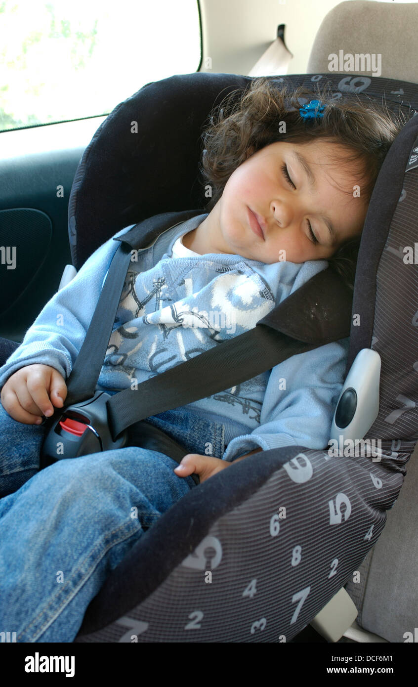 Little girl sleeping in the back of a car Stock Photo Alamy