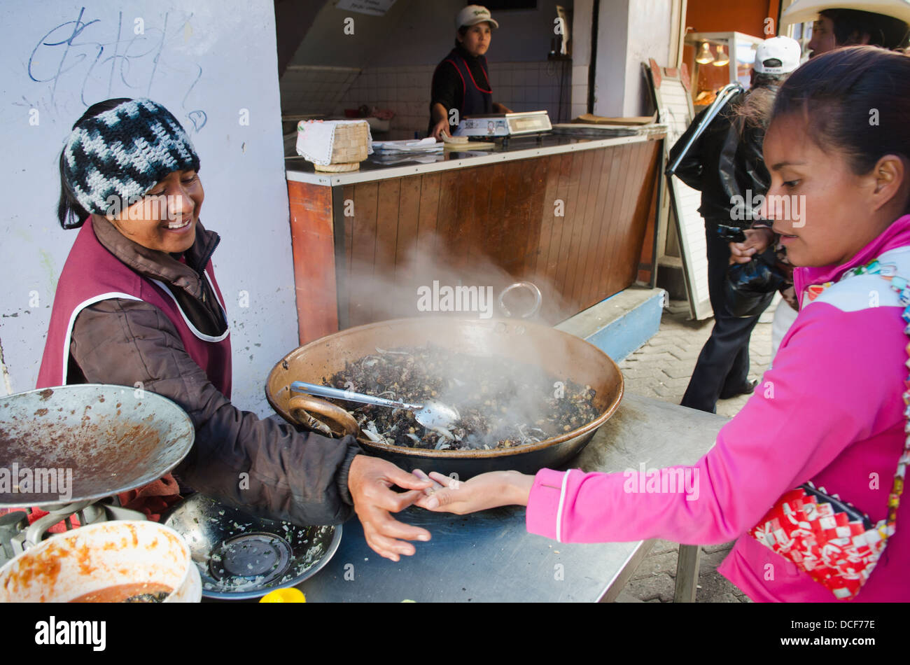 Woman making moronga (mixture cooked in cow's blood) at outdoor food market; San Luis de la Paz, Guanajuato, Mexico Stock Photo