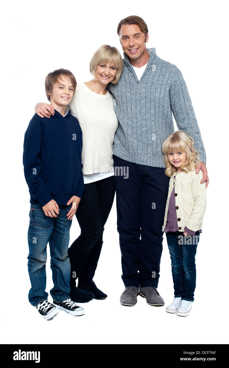 Affectionate family feeling the warmth of love, standing close to each other. Stock Photo