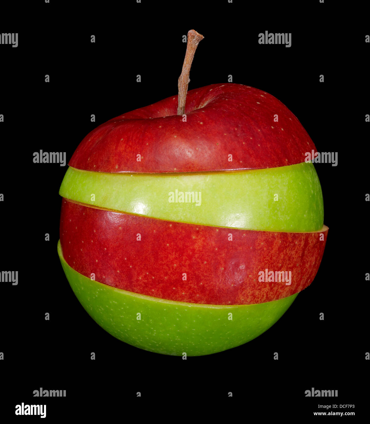composite fruit made of red and green apple slices in black back Stock Photo