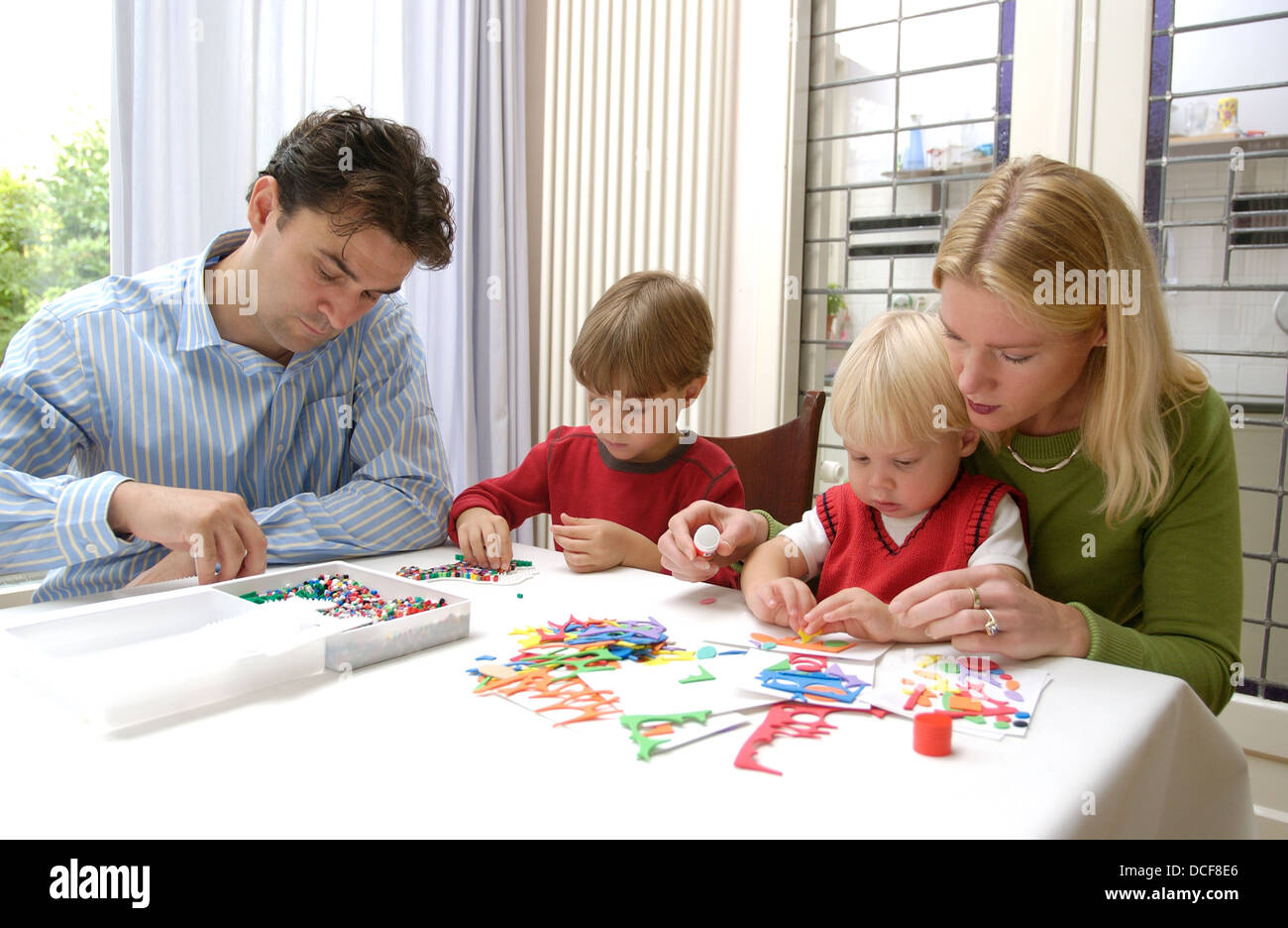 Their Making Parents making handicraft with their sons Stock Photo - Alamy