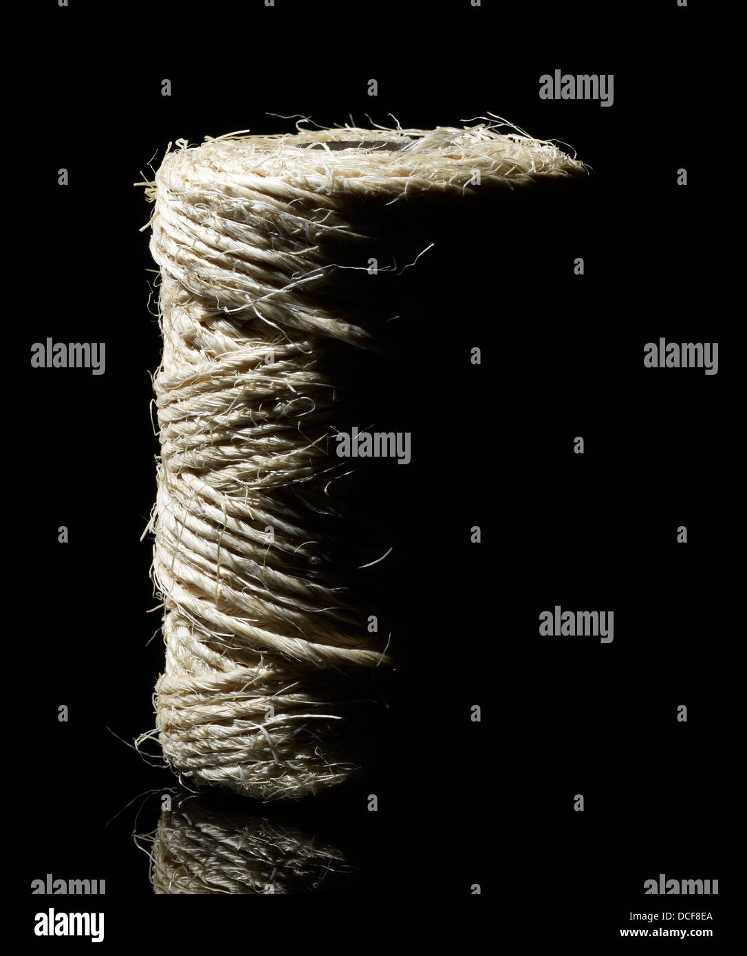 coin of yarn in dark back Stock Photo