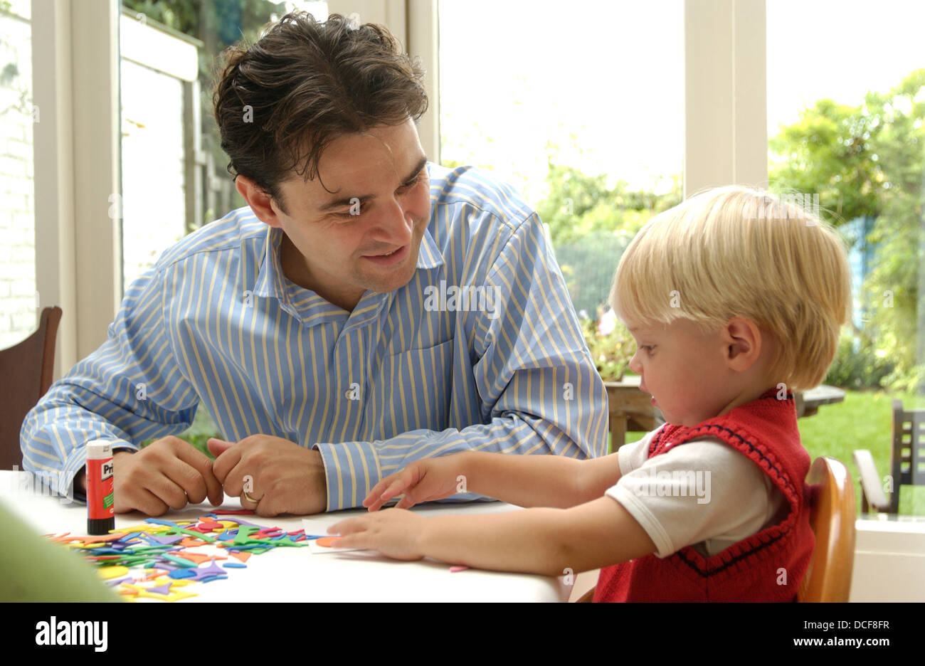 Their Making Parents making handicraft with their sons Stock Photo - Alamy