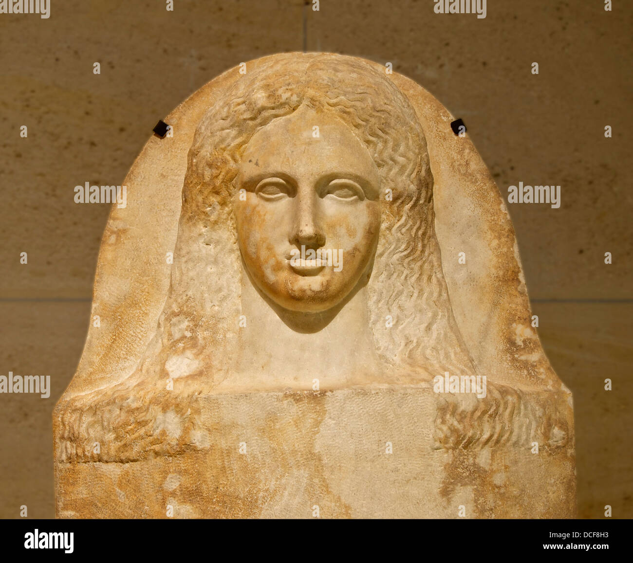 Cover of a phoenician anthropoid sarcophagus of a woman (detail). Head of a young women Stock Photo