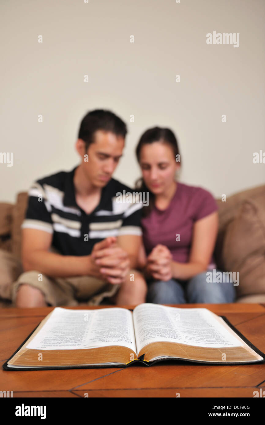 A Christian Couple Praying Together Stock Photo