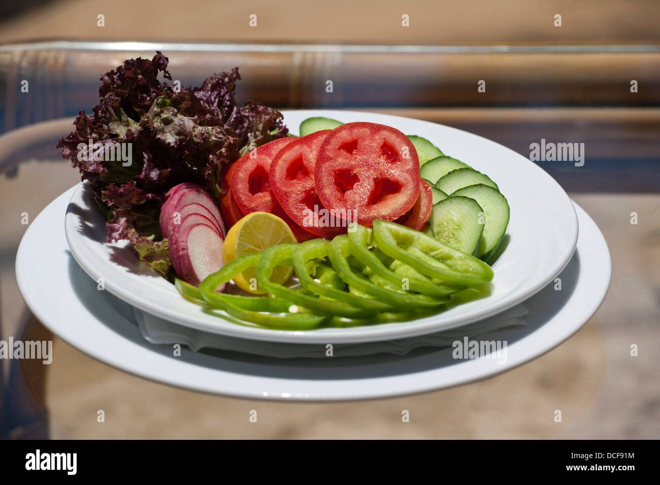 Shallow focus image of a red and green pepper salad outdoors Stock Photo