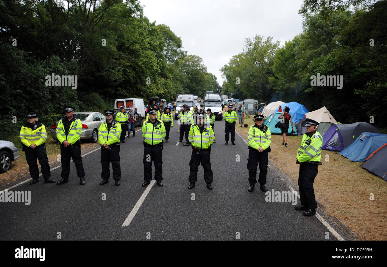 Balcombe Sussex UK 16 August 2013 - Police and Anti Fracking protesters gather at the Cuadrilla site in the West Sussex village of Balcombe where the company are carrying out exploration drilling . Thousands of protesters are expected to join the protest over the forthcoming weekend Photograph taken by Simon Dack Credit:  Simon Dack/Alamy Live News Stock Photo