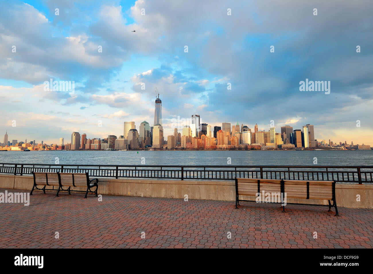 Downtown Manhattan skyline at sunset over Hudson River in New York City ...