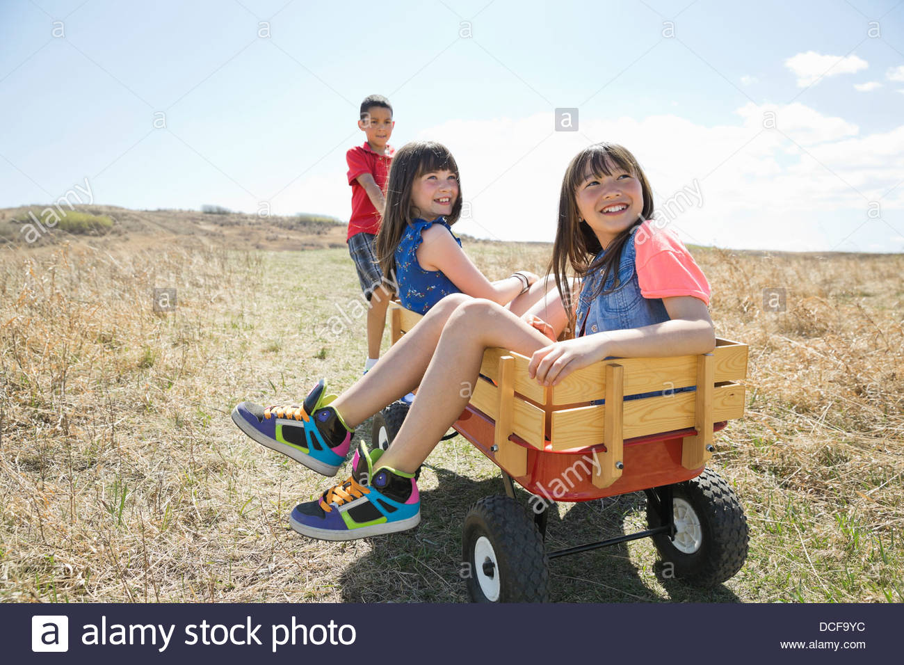 Pulling child in wagon hi-res stock photography and images - Alamy