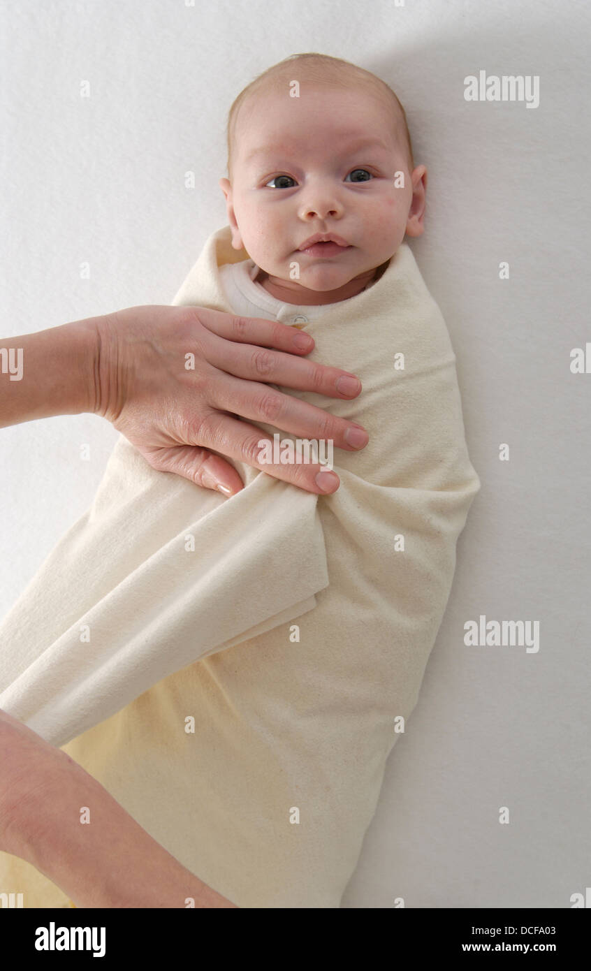 Newborn baby wrapped in a blanket Stock Photo Alamy