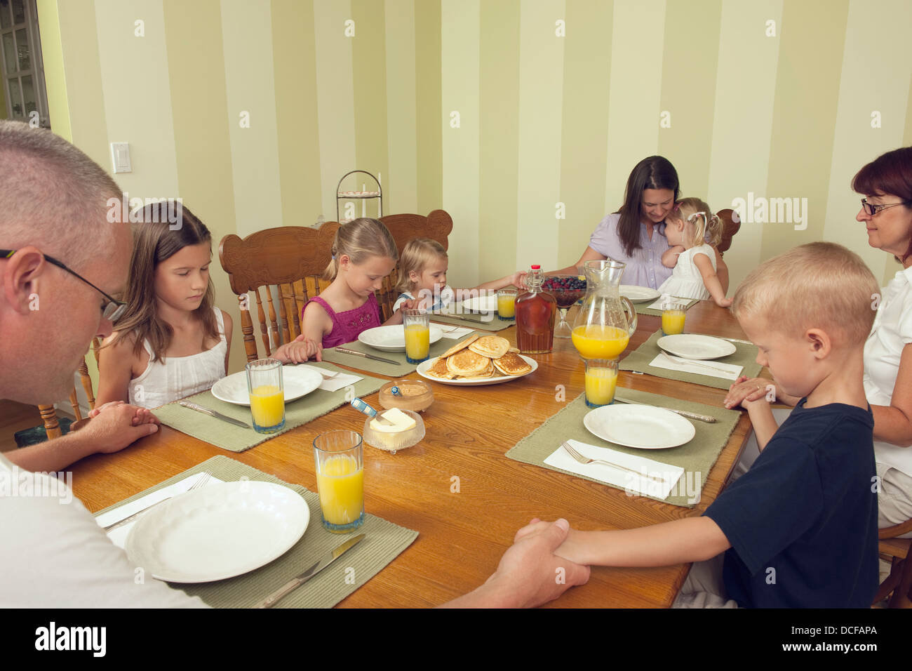 Family Praying For Food Stock Photo