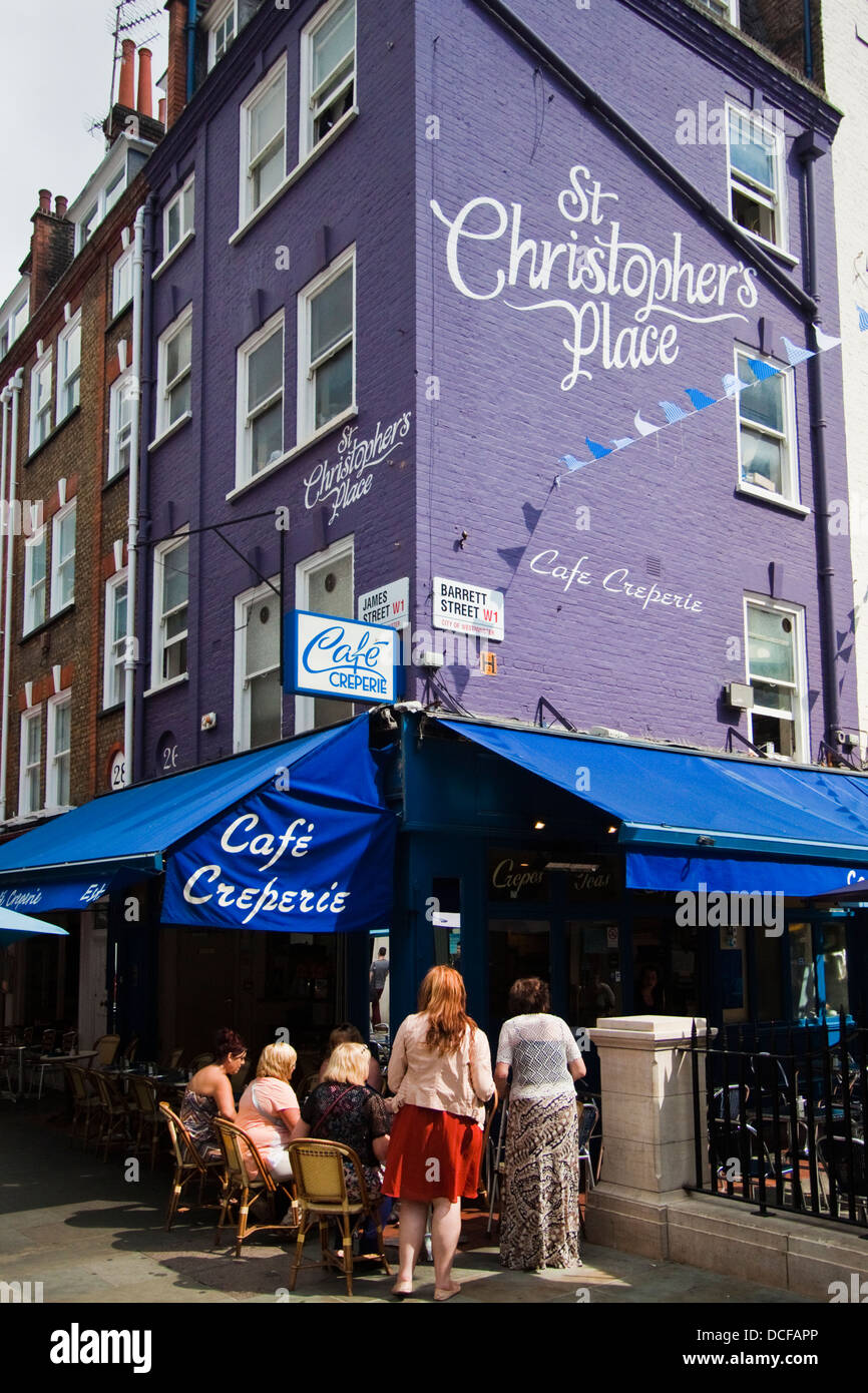 People sitting outside cafe at St.Christophers place, London Stock Photo