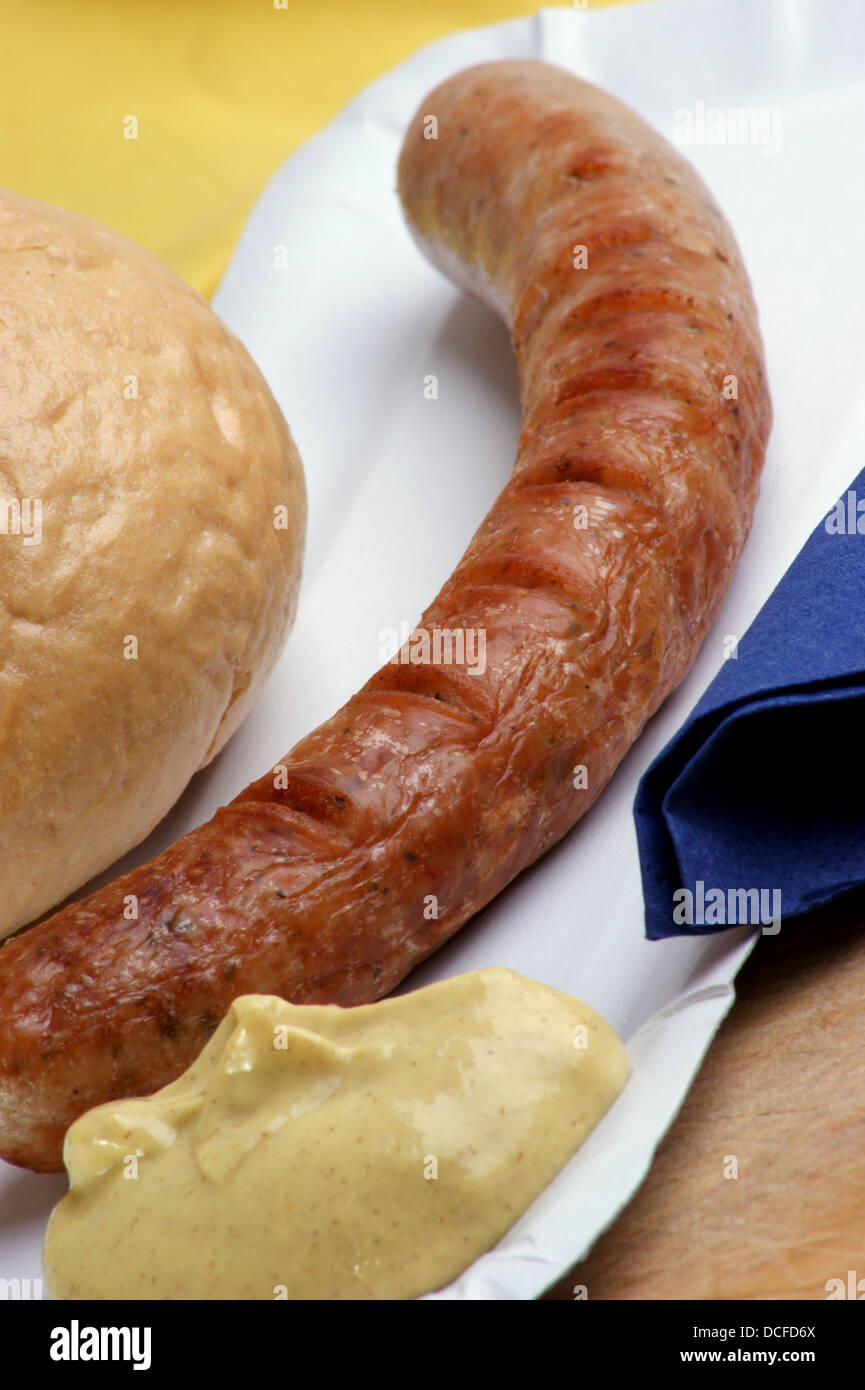 ham sausage with mustard on paper plate Stock Photo Alamy