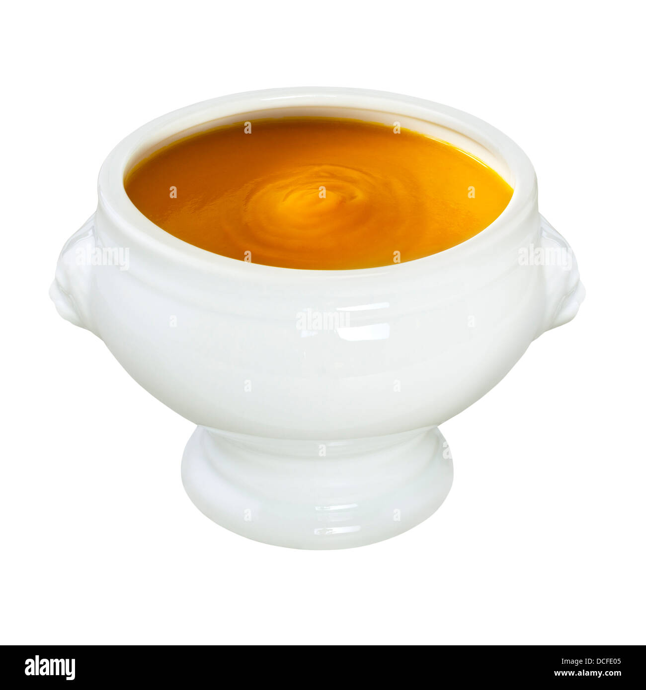 Pumpkin Soup - a bowl of steaming hot pumpkin soup, in a lion head bowl, on a white background, front to back focus... Stock Photo