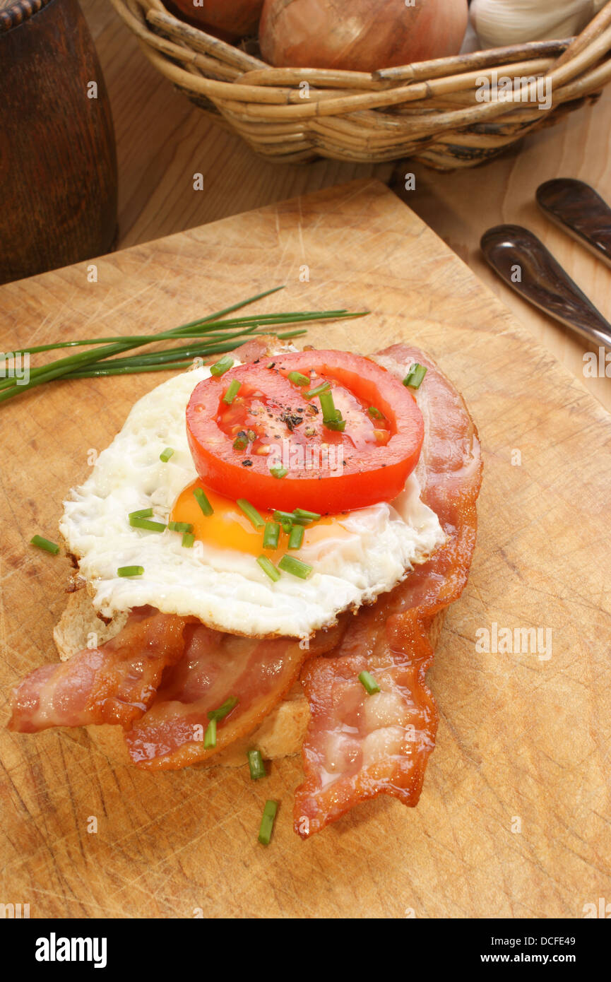 tomato bread with grilled bacon and friend egg Stock Photo Alamy