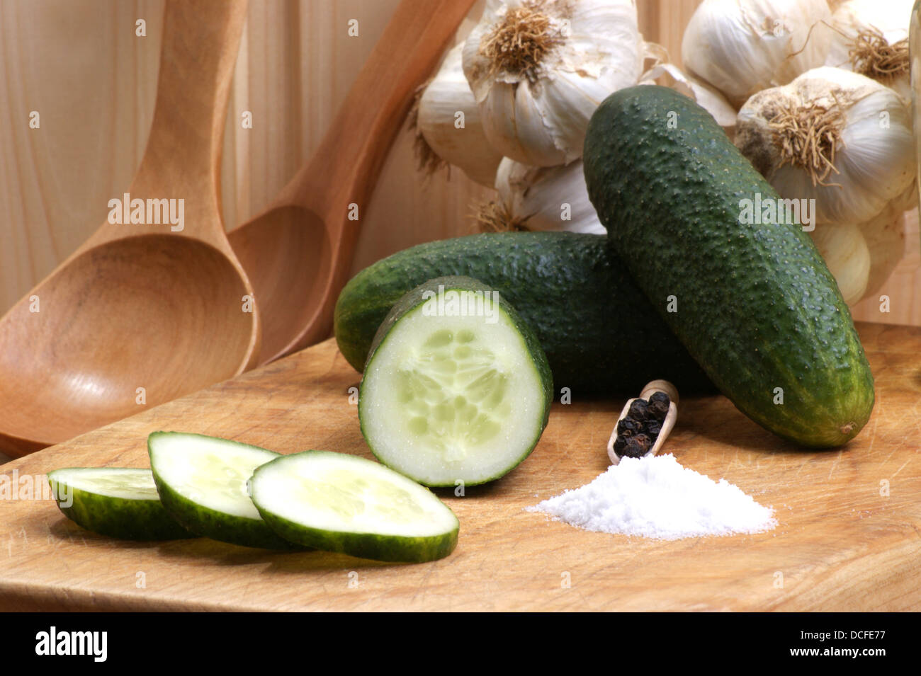 organic gherkin with salt on a timber board Stock Photo - Alamy