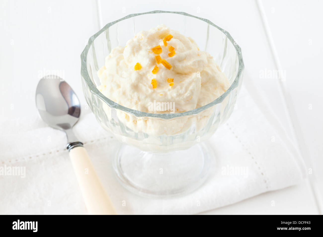 Syllabub - traditional English dessert made from whipped cream, light rum and flavoured with lemon and orange. Stock Photo
