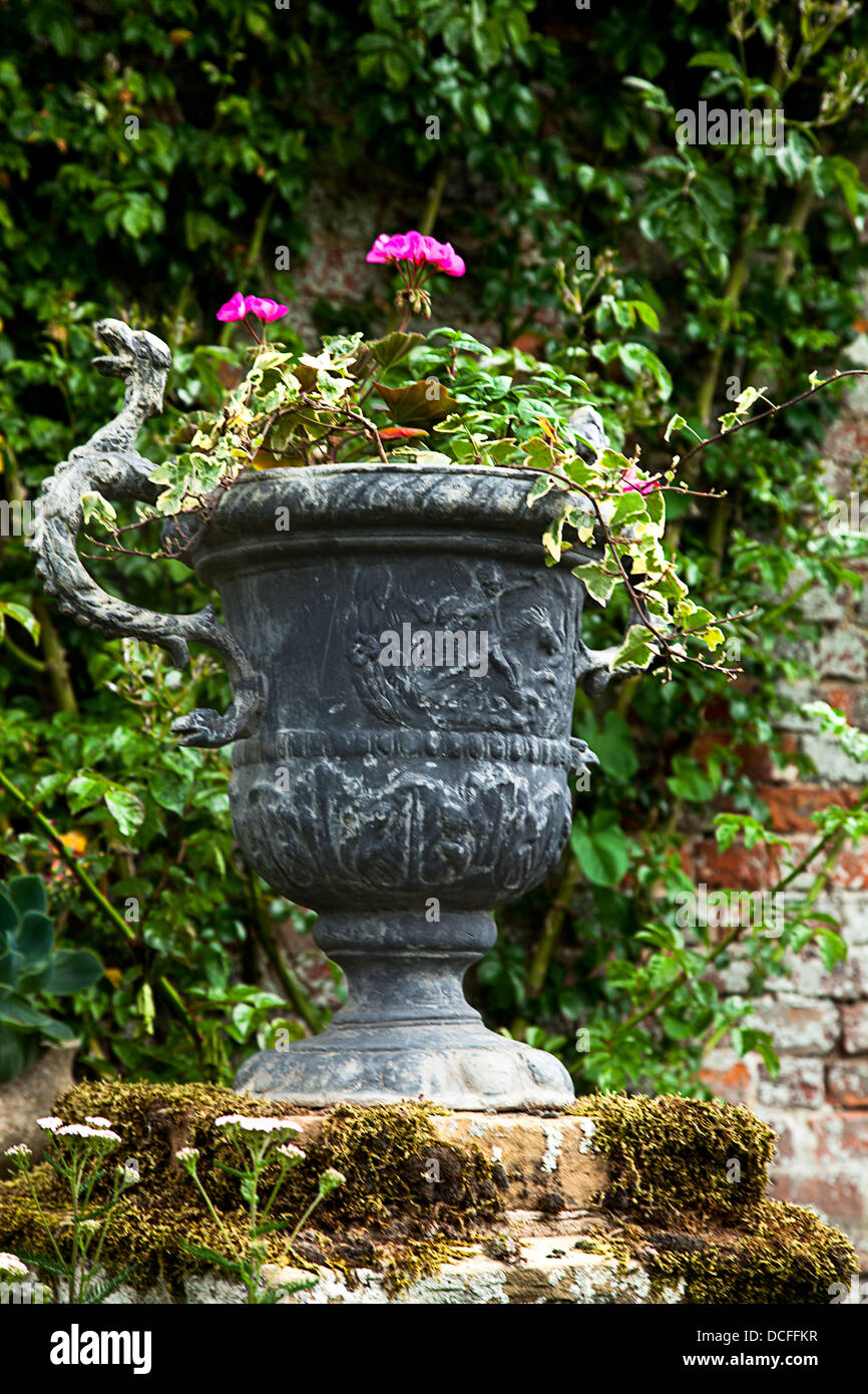 A garden urn with flowers planted Stock Photo Alamy
