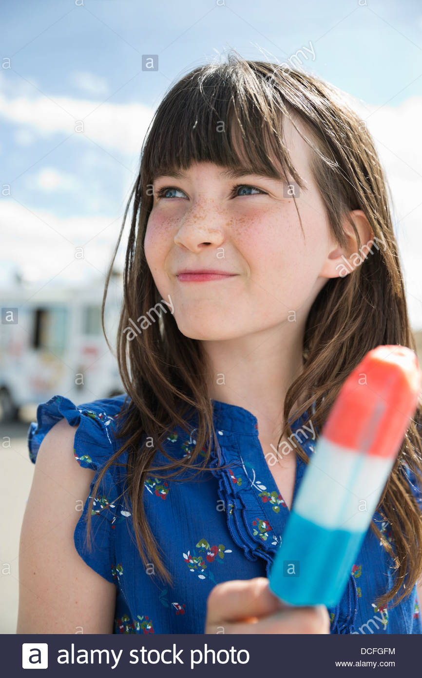 Closeup of little girl holding popsicle Stock Photo Alamy