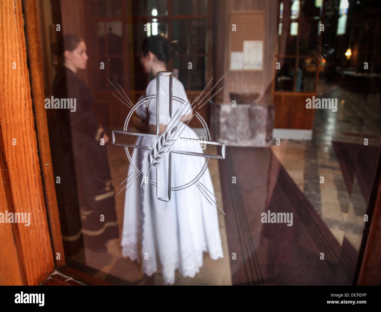 Two woman talking in church Stock Photo Alamy