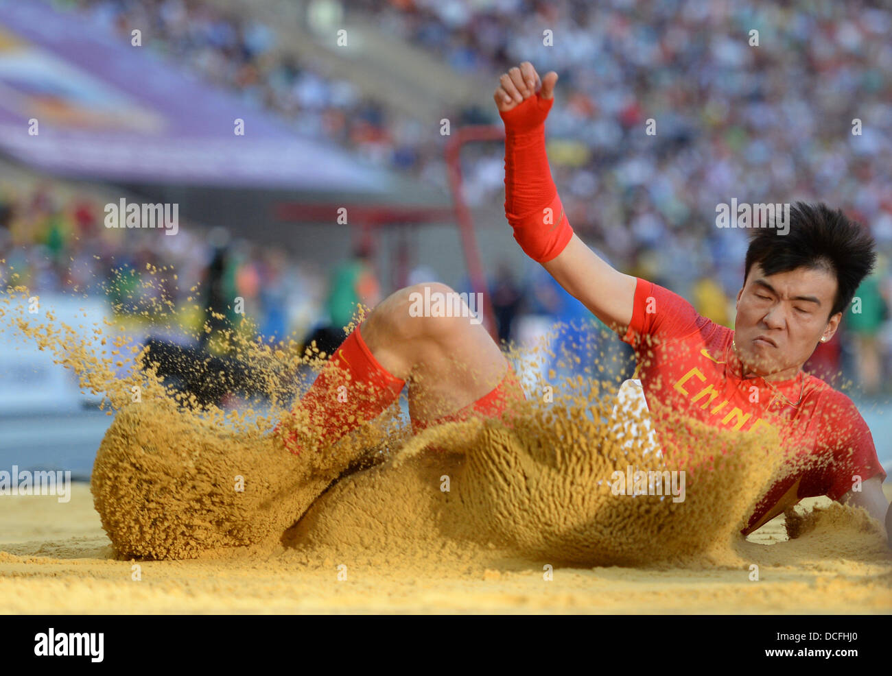 Moscow, Russia. 16th Aug, 2013. Jinzhe Li of China competes in the Men's Long Jump Final at the 14th IAAF World Championships in Athletics at Luzhniki Stadium in Moscow, Russia, 16 August 2013. Photo: Bernd Thissen/dpa/Alamy Live News Stock Photo