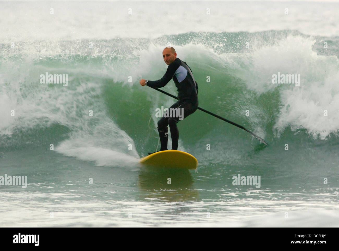 Surfer Catching A Wave Stock Photo Alamy