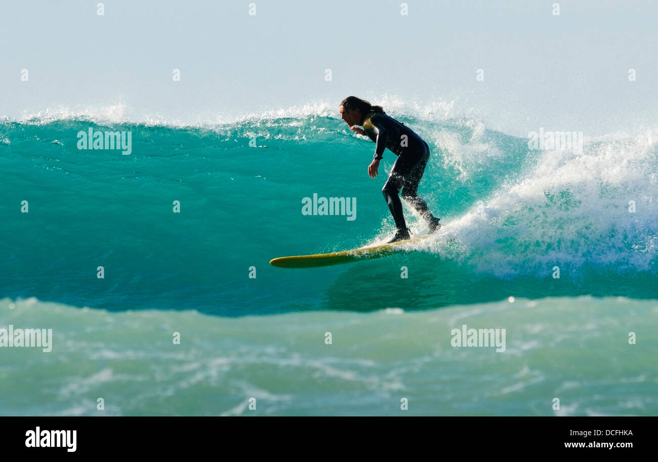 Surfer Catching A Wave Stock Photo Alamy